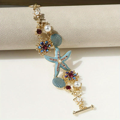Wunderschönes Armband mit Seestern-Anhänger, Muscheldetails und Meerkorallen-Perlen