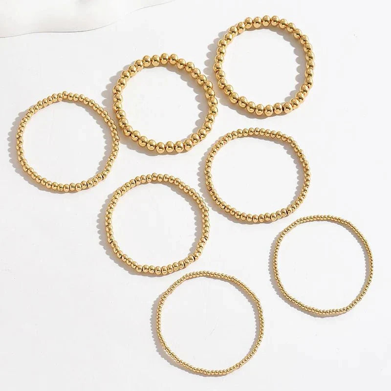 7-teiliges Goldenes Perlenarmband-Stapelset