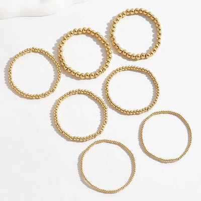 7-teiliges Goldenes Perlenarmband-Stapelset