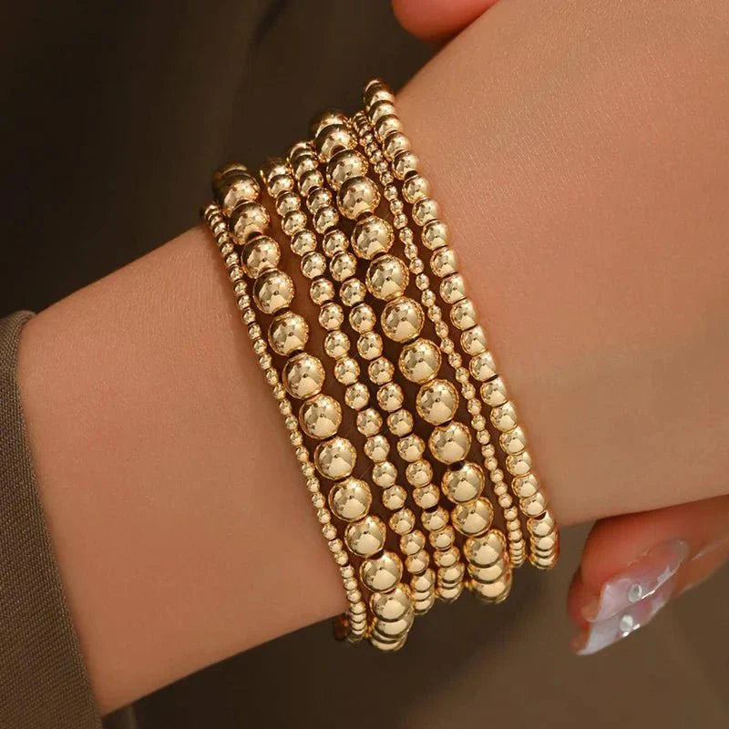 7-teiliges Goldenes Perlenarmband-Stapelset